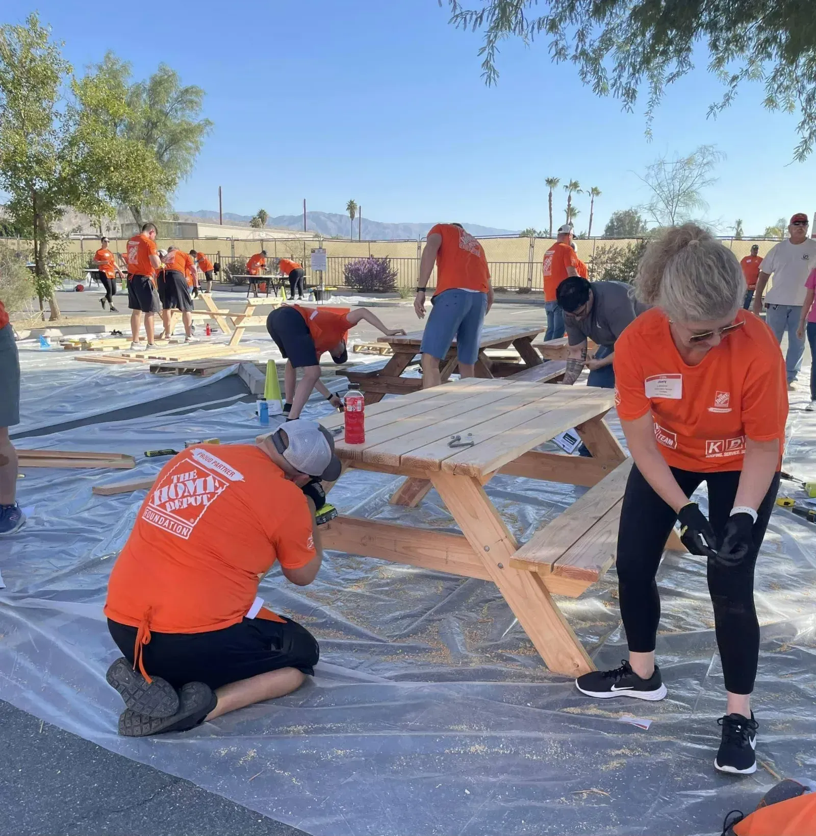 Home Depot Foundation volunteers building picnic tables for the ranch